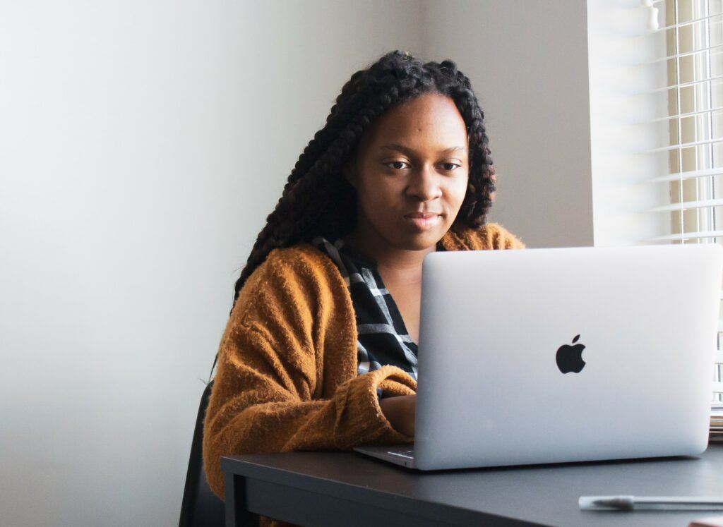 Woman working at laptop computer